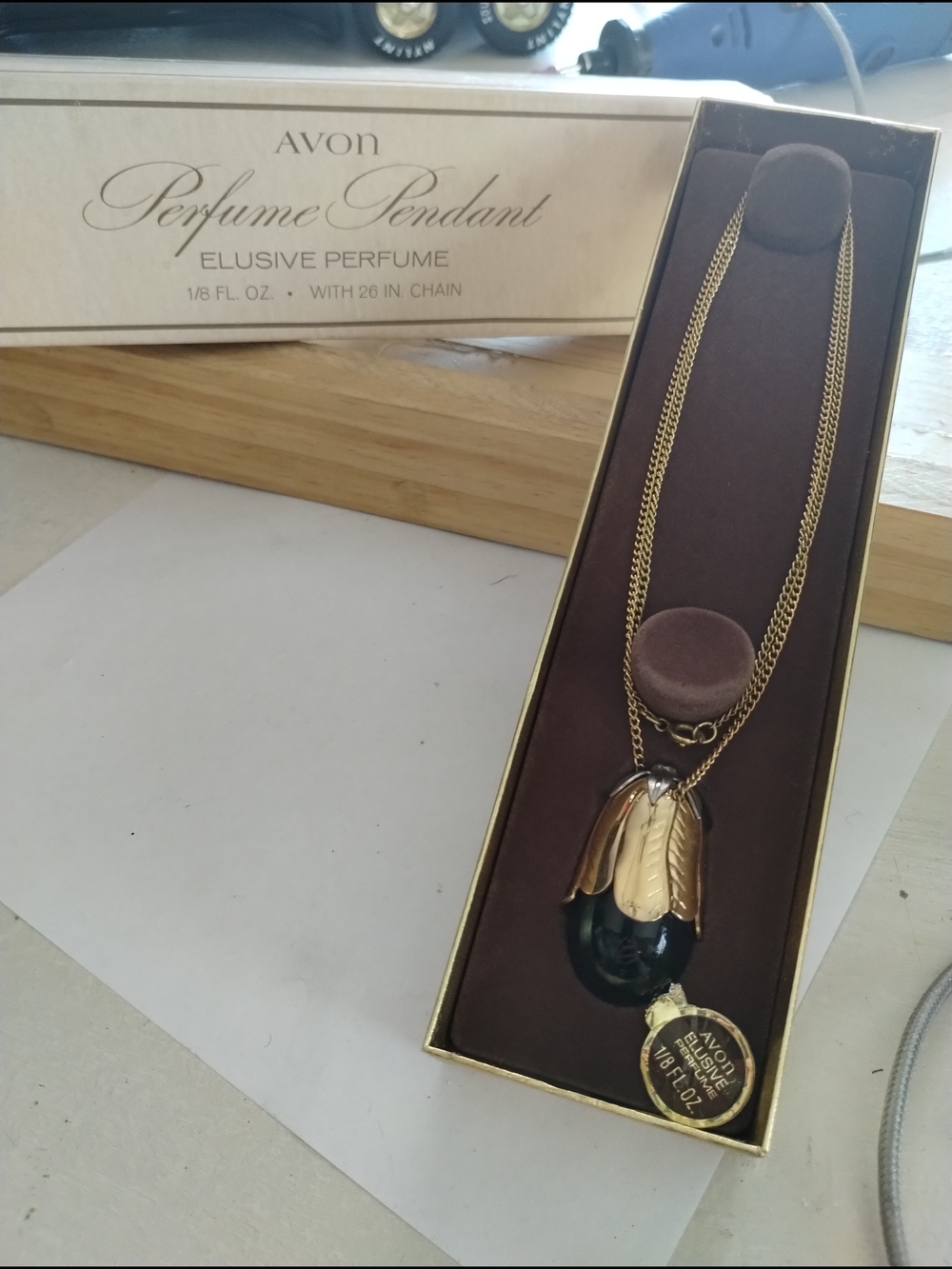 Avon Gold and Black Elusive Perfume Pendant Necklace